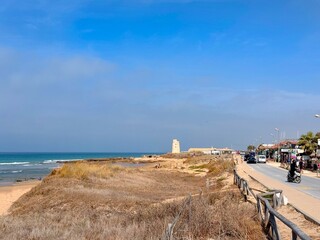 Playa del Palmar, El Palmar de Vejer: beach huts, bars and surf schools with view to the Torre Vigía El Palmar at the dunes and beautiful beach, Atlantic Ocean, Costa d © keBu.Medien