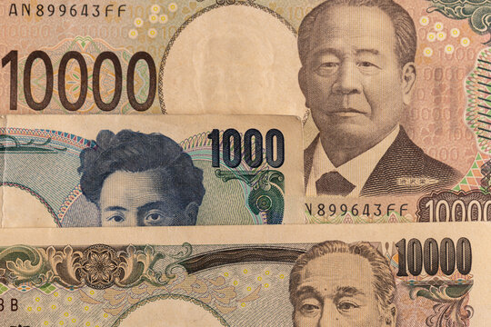 Japanese yen banknotes background close up including 10000 2000 and 1000 yen bills