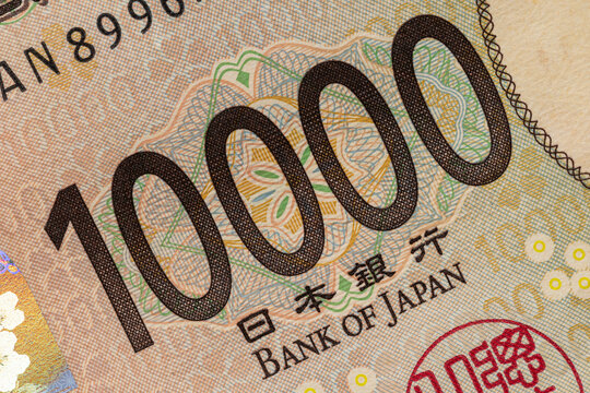 Japanese yen 10000 bill number macro close up with Bank of Japan inscription