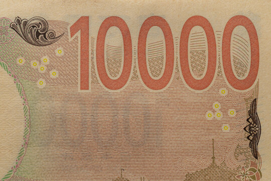 Japanese 10000 yen bill reverse side detail macro close up with large denomination number and watermark space