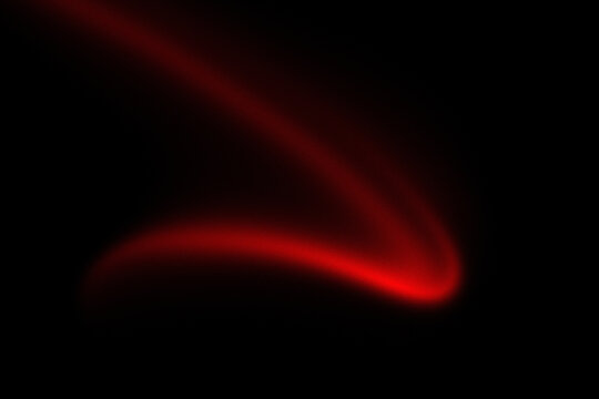 Abstract glowing red light trail on black background