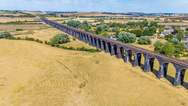 An aerial view above the spectacular Harringworth Viaduct after a long dry summer