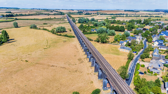 An aerial view above the spectacular Harringworth Viaduct as it bisects the Welland Valley after a long dry summer