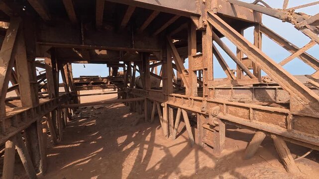 An abandoned, rusty oil rig on the Skeleton Coast, Namibia, Africa.