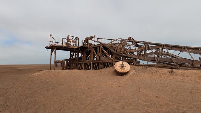An abandoned, rusty oil rig on the Skeleton Coast, Namibia, Africa.