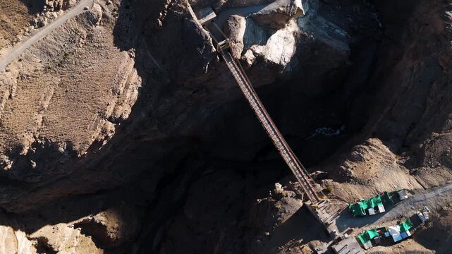 Stunning Aerial Drone Landscape of Chicham Bridge in Spiti Valley, Himachal Pradesh Showing the Iconic Mountain Crossing Above a Deep Gorge and Vast Barren Himalayan Mountains