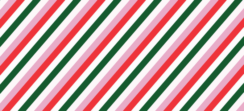 Festive diagonal striped pattern with red green and pink lines on white background