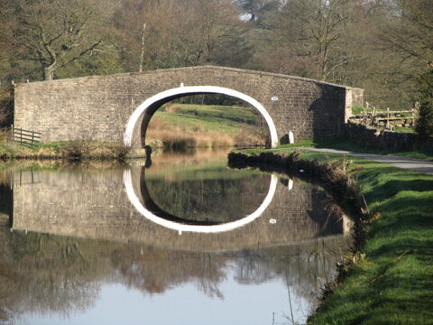 Hollinhurst bridge 148 Leeds Liverpool canal. A Grade II listed accommodation bridge, built 1794 by R Whitworth. Made of dressed stone, single elliptical arch with rock faced voussoirs,coped parapet