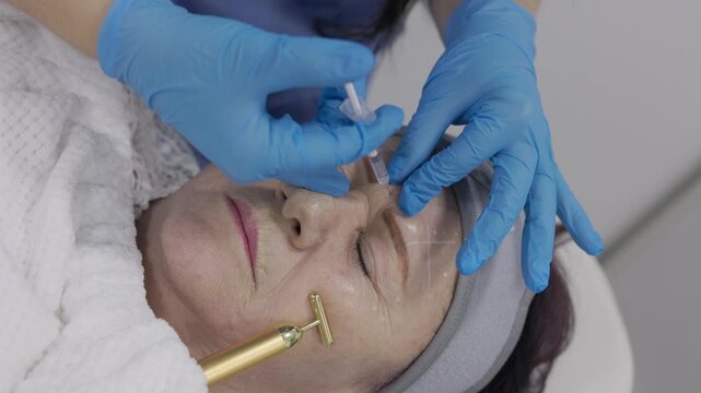 Botulinum toxin injection process in a cosmetic clinic for facial enhancement