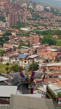 People visiting jesus statue at comuna 13 in medellin, colombia
