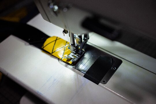 Close up of a sewing machine stitching technical fabric