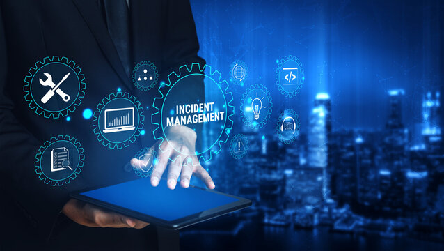 Businessman Holding Tablet With Icons Representing Incident Management In A Modern Cityscape Background With Blue Digital Effects. Glyphic.