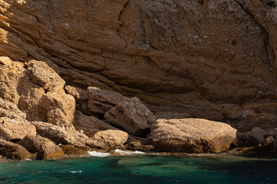The coastline of Thassos Island. The marine landscape in Greece. Rocks, sea, trees, sky.