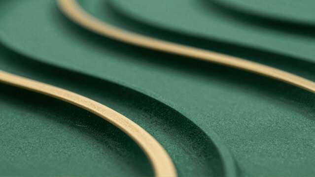 close green fabric curved pattern fabric appears soft textured material possibly felt similar material pattern multiple curved lines overlapping creating sense depth dimension lines light beige color