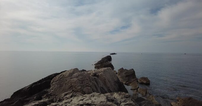 Low Angle View of Rocky Ridge Extending into Sea, Trapani, Italy
