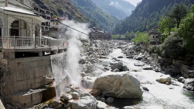 Hot Water Spring Flowing Into a Rocky River in Manikaran Valley India