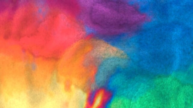 Rainbow watercolor paint bleeding and blending on textured paper abstract background seamless loop