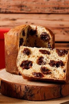 Christmas panettone with a soft interior and rich chocolate filling, served on a rustic table.