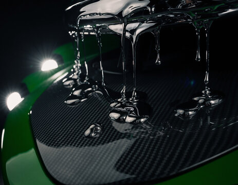 Macro Viscous Clear Liquid Dripping on Dark Carbon Fiber Texture