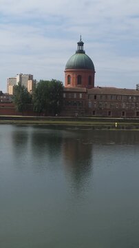 Historic La Grave Hospital and Garonne River Waterfront in Toulouse, France