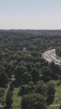 Aerial Reveal of White Plains Neighborhood and Distant City Skylin