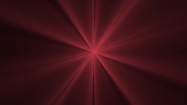 Radiant red light beams emanate from a central point creating a symmetric starburst pattern in this dynamic digital motion video footage for modern abstract visual backgrounds