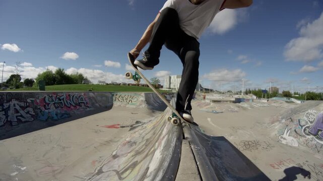 Extreme sports skateboard back flip trick in skatepark