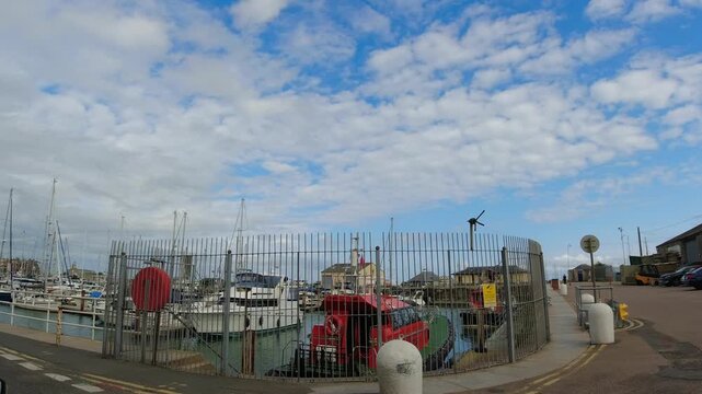 Car Mounted Wide Angle Camera Street View Footage of Ramsgate Beach and Ocean City of England, United Kingdom. Footage Was captured on 1st August, 2025 During Mostly Black Cloudy Day of Summer