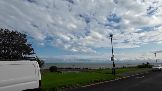 Car Mounted Wide Angle Camera Street View Footage of Ramsgate Beach and Ocean City of England, United Kingdom. Footage Was captured on 1st August, 2025 During Mostly Black Cloudy Day of Summer