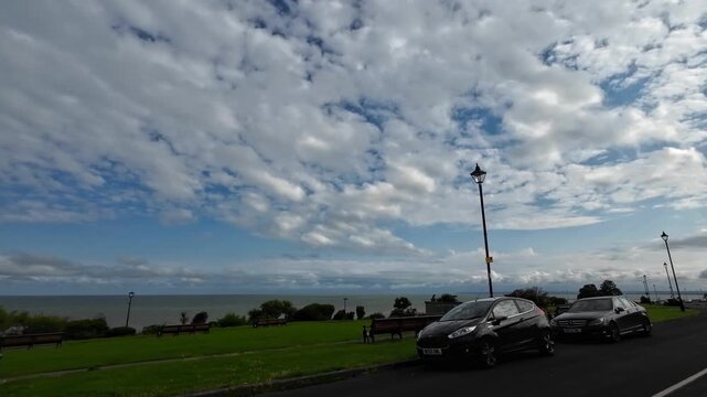 Car Mounted Wide Angle Camera Street View Footage of Ramsgate Beach and Ocean City of England, United Kingdom. Footage Was captured on 1st August, 2025 During Mostly Black Cloudy Day of Summer