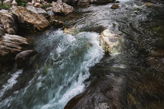 A waterfall along the Avers Rhine river in the Magic Wood climbing area of Ausserferrera, Switzerland 