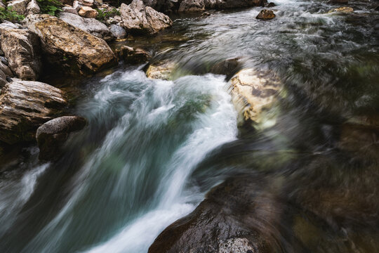 A waterfall along the Avers Rhine river in the Magic Wood climbing area of Ausserferrera, Switzerland 