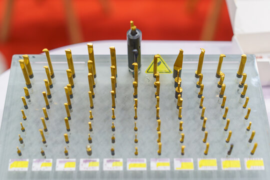 Assorted gold titanium coated CNC cutting tools on display