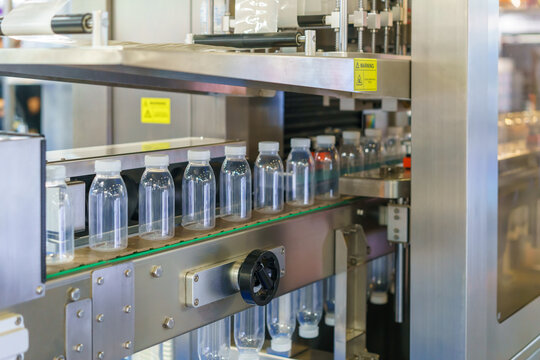 Empty Plastic Bottles on Production Line Conveyor