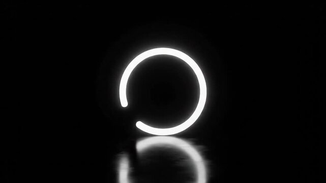 Glowing white incomplete circle reflected on dark surface