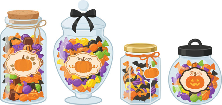 Four glass jars filled with Halloween themed candies and treats on a white background with copy space