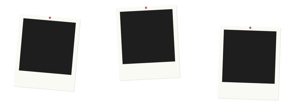 Three blank polaroid photo frames pinned