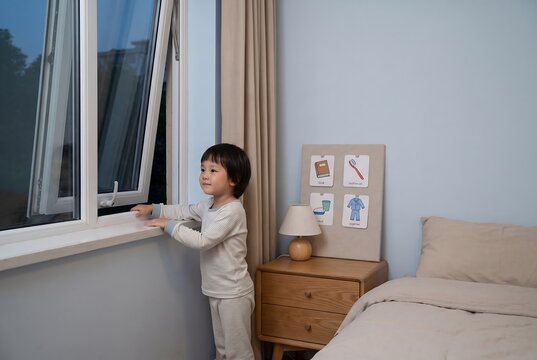 Child Opening Window During Independent Morning Routine