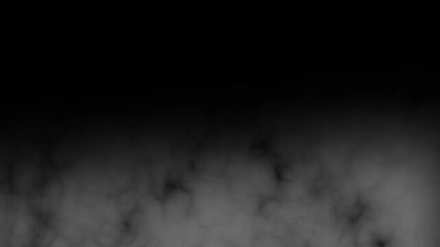 Dense white ground fog rolling continuously against a dark isolated background