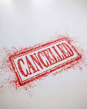 Red rubber stamp impression with the word CANCELLED stamped in bold letters, conveying a message of termination.