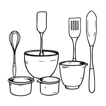 Set of kitchen tools including mixing bowl whisk spatula and measuring cup