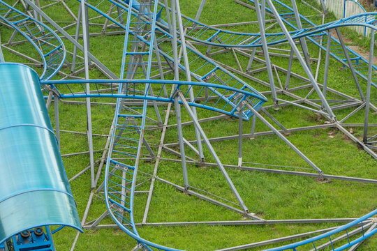 Thrilling twists and turns of the roller coaster create excitement in the amusement park landscape