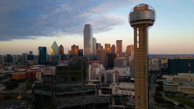 Aerial close up view of Reunion tower with the Dallas Texas skyline at sunset.