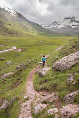 Fototapeta premium Woman hiking mountain trail in pyrenees valley
