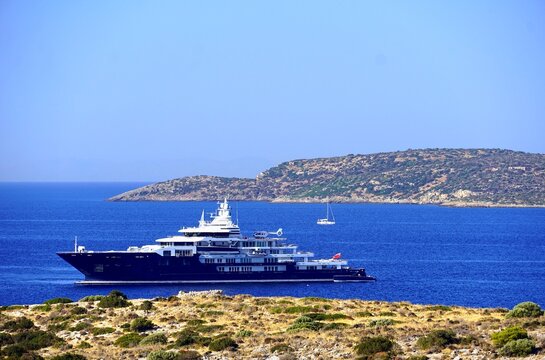 A luxury yacht with a helicopter, near the coast of Varkiza, in Attica, Greece