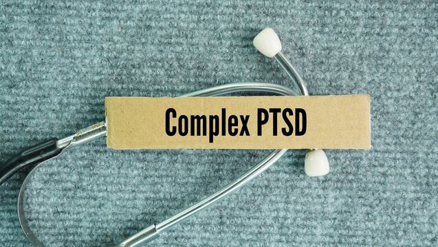 Stethoscope with the words Complex PTSD. mental health condition that develops from prolonged, repeated trauma where escape feels impossible