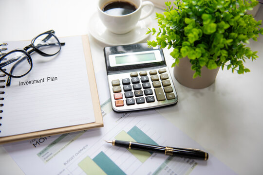 Retirement investment planning with saving, calculate and notebook for future financial security.  Financial Wellness for retirement Concept