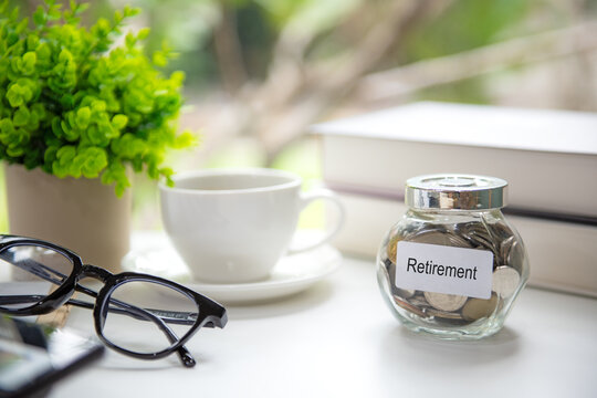 Retirement planning with saving jar, calculate and notebook for future financial security.  Financial Wellness for retirement Concept
