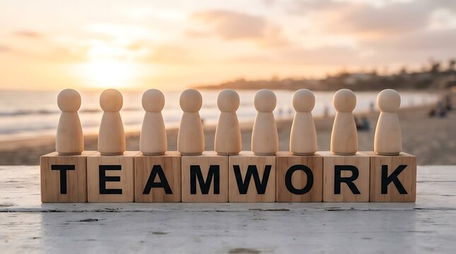 Wooden peg dolls standing on blocks spelling teamwork at sunset