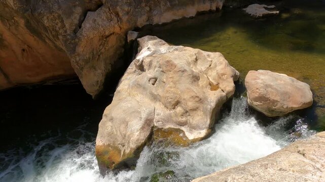 Walking footage along the Canaleta River (La Fontcalda swimming area) on sunny day. Gandesa, Tarragona, Spain.